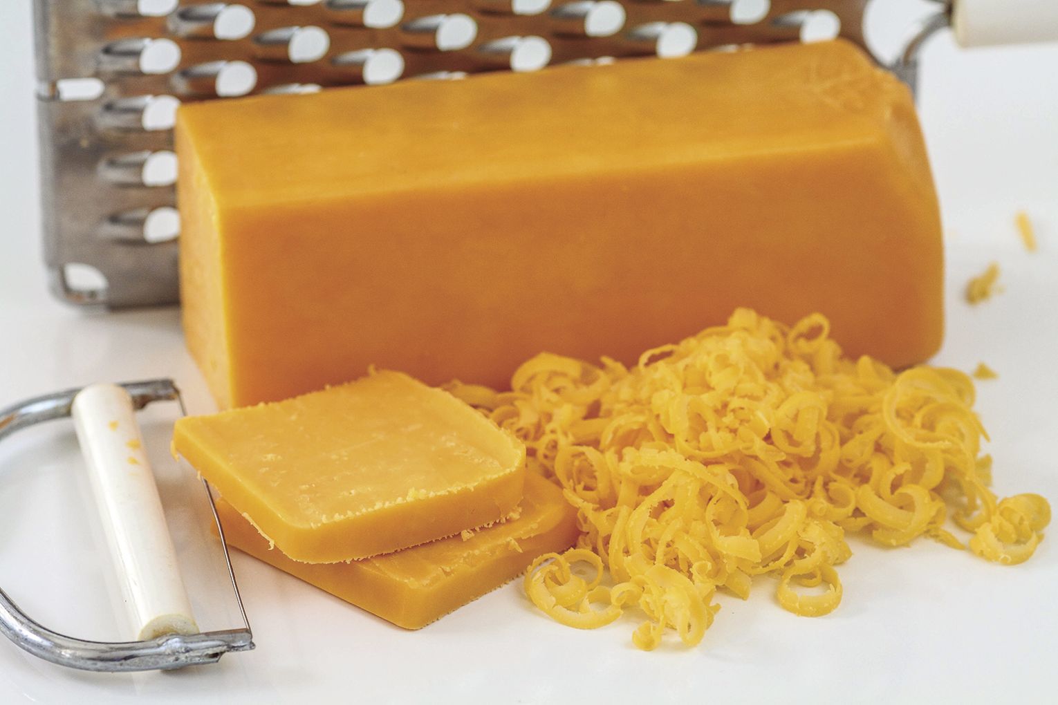Butter and wrap sliced cheese.